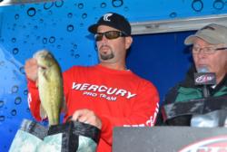 Pro John Hutchins of Warrenton, Va., shows off part of his first-place catch during the finals of the EverStart Series event on the Potomac River.