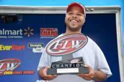 Marvin Reese of Gwynn Oak, Md., proudly displays his first-place trophy after winning the EverStart Series co-angler title on the Potomac River.