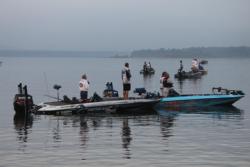 FLW Tour anglers pause for the national anthem prior to the day-one takeoff.