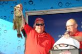 Howard Poitevint hoists his tournament-winning bass, a 7-13 brute that he caught on the last cast of the day.