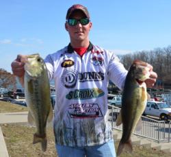 Co-angler Justin Swast of Pevely, Mo., shows off his two best from his 12-pound, 2-ounce catch which consisted of only four bass. 