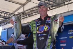Pro leader Brandon Coulter holds up part of his 14-pound, 12-ounce day-two stringer.