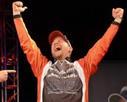 Co-angler Steven Meador celebrates after winning the Walmart FLW Tour event on Beaver Lake. 