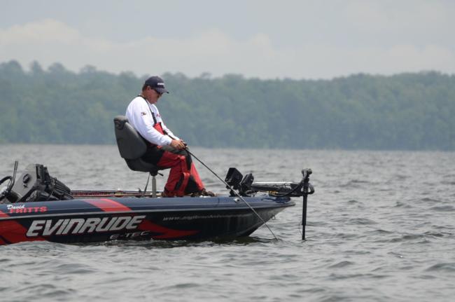 David Fritts sits perched on his chair while watching his flasher and throwing crankbait. 