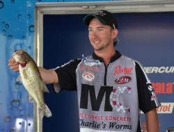 Co-angler champion Bryan New holds up his lone fish Saturday, a 3-pound Lake Eufaula largemouth.