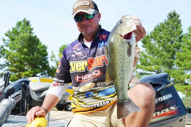 EverStart team pro Randall Tharp of Port Saint Joe, Fla., proudly displays part of his first-place catch during the opening round of Forrest Wood Cup competition.