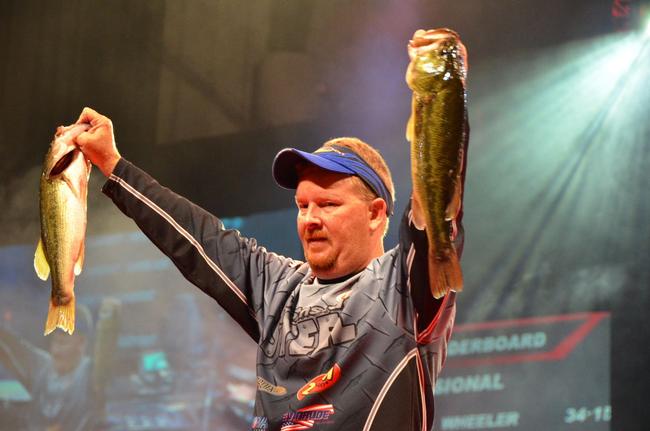 2013 BFL All-American winner Kerry Milner proudly displays his catch during the third day of Forrest Wood Cup competition.