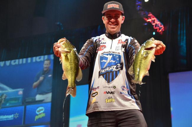 Jacob Wheeler shows off his catch en route to a second-place finish at the 2013 Forrest Wood Cup.