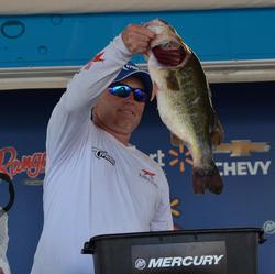 Second-place co-angler Ken Coats holds up his kicker from day three on Lake Okeechobee.