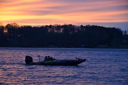 Boaters make their way across Lake Keowee at sunrise.