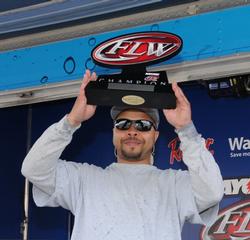 Marvin Reese finds the Rayovac Co-angler Division trophy to be a featherweight after heaving around eight and nine pound bass all day.