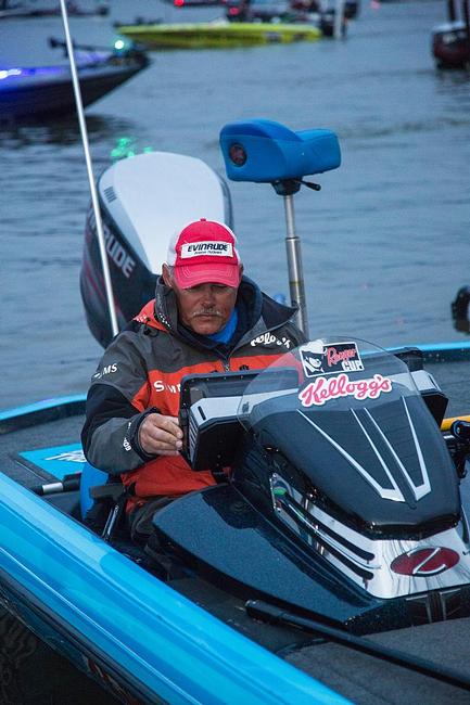 Local favorite Jim Tutt runs a systems check on his Lowrance electronics prior to takeoff. 
