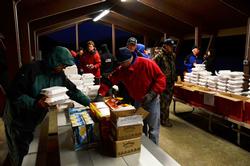 Anglers browse the food selection Monday morning.