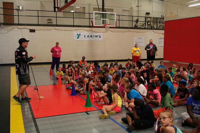 Pro Tom Redington talks about the importance of science and math at a local YMCA.