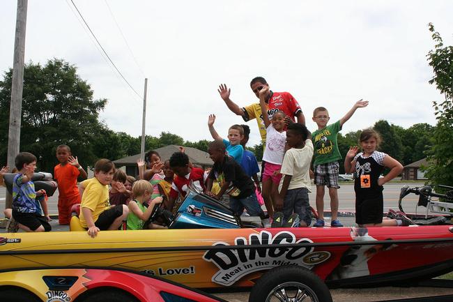 The Dingo boat was a crowd favorite. Here, Vic Vatalaro and a few of the YMCA camp attendees cheese it up for the camera.