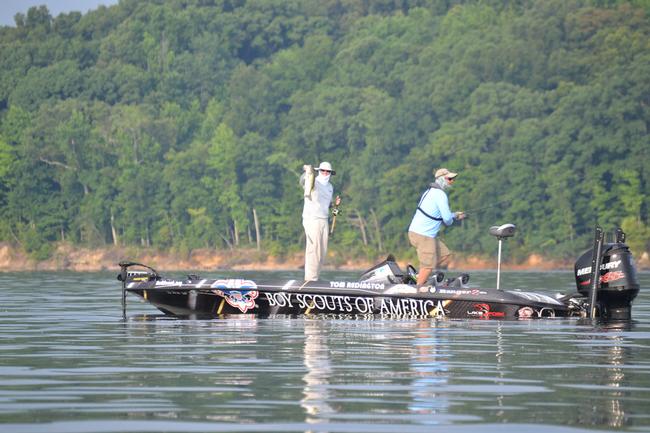 Texas pro Tom Redington is swathed in protective clothing and catching bass on day one of the FLW tour event on Kentucky Lake. 
