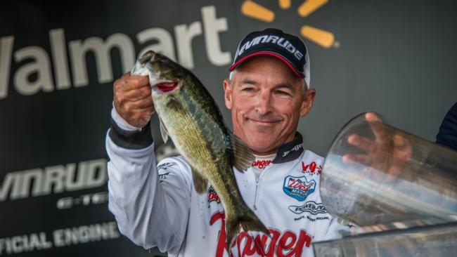 Clark Wendlandt drops a spotted bass in the tank. He came closest to surpassing Lefebre and finished second with 63 pounds, 7 ounces.