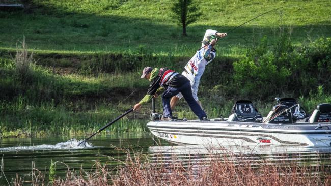 Top pro Ray Hanselman pulls hard and co-angler partner Ryan Lejeune reaches out to net a big keeper.