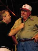 Hoot Gibson shares a story with Wal-Mart FLW Tour host Charlie Evans onstage at Shreveport.