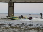 The Poulan boat hits the throttle and makes its way out underneath the I-10 causeway.