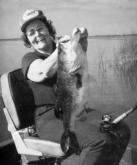 Nina Wood, Ranger Boats co-founder, holds up one of her many great catches during the company