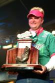 Pro Ray Scheide of Russellville, Ark., shows off his first-place trophy after winning the FLW Tour event on Lake Okechboee.