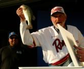 Pro Jim Lyon of Reno, Nev., weighs in one of his smaller bass as Marcus Clouse looks on. Lyon finished with a two-day total of 12 pounds, 4 ounces and fell to third place, worth $7,500.