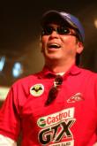 Co-angler Katsutoshi Furusawa of Toyko, Japan, shares a laugh onstage after winning a new pair of shades for his victory on Old Hickory Lake.