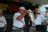 Albert Pieper of Summerville, S.C., puts his last fish on the scales for the co-angler victory.