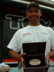 Chris Slopak of Hot Springs, Ark., proudly displays his first-place trophy after winning the Co-angler Division title at the 2004 TTT Championship.