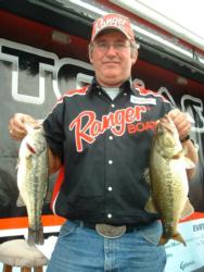 Co-angler Don Poston of Odessa, Texas, holds up part of his two-day 20-pound, 11-ounce stringer. Poston ultimately finished in second place in the 2004 TTT Championship.
