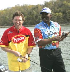 Country music performer Craig Morgan wets a line and shares a laugh with FLW Tour pro Robert Pearson on Beaver Lake before his performance at the Wal-Mart Open.