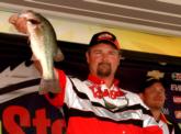 Pro Jeffrey Thomas of Broadway, N.C., caught 15 pounds even Saturday, finished with a final total of 26-15 and took third place. Pro Brian Wilhoit, leading at the time, looks on in the background.
