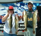 Aaron McQuoid and Edna Vandersteen hoist their day-two catch from Devils Lake. McQuoid moved up to second place on the pro side.
