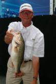 Pro Kelly Albert jumped from ninth to second on day two and holds up a bass from his 17-13 stringer.