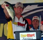 As Chris Poole looks on, Rick Morris weighs in a five-bass limit worth 13 pounds, 12 ounces Saturday. Morris finished second with a final weight of 25-0.