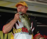 Rick Taylor kisses a bass that handed him an early lead on day three. He eventually ended the day in third with a total catch of 16-11.