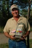 Lake Michigan co-angler champion Homer Stephens poses with his trophy.