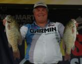 David Reault displays a pair of bass from his day-three sack of 18-13 that put him in third place heading into the final day.