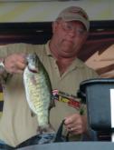 Co-angler winner Neil Heiden weighs in a fish from his five-bass stringer, one of two co-angler limits on day four.