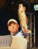Pro Kevin Goligowski of Maplewood, Minn., weighs in a walleye for the big-fish award. He placed fifth Wednesday with a two-walleye weight of 8 pounds, 5 ounces.