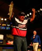 Pro Shannon Kehl pumps his fist as he weighs in his final fish, temporarily giving him the lead in the 2005 Wal-Mart FLW Walleye Tour Championship. 