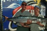 Capt. Bill McLamb and Shannon Rowland of Team Miss Micki show off the 26-8 kingfish that earned them eighth place.