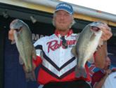 Guy Adams holds up a pair from his 14-pound, 7-ounce day-one catch that put him in third place heading into the final day.
