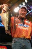 Opening-round leader Tim Carroll holds up the heaviest bass of the day, proving he