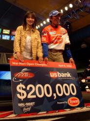 Shinichi Fukae and his wife, Miyuki, collect another winner's check.