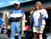 Jeff Ryan and Kristine Szczech display their day-one catch.