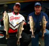 Todd Riley and Kevin Bruer show off their five-walleye limit caught on day two.