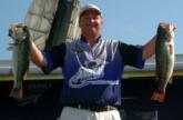 Runner-up Yancy Windham holds up the two best bass from his day-four sack of 19-14. He caught 38-2 over two days.