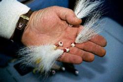 An 1/8-ounce white, hand-tied bucktail jig perfectly imitates a minnow in cold water.